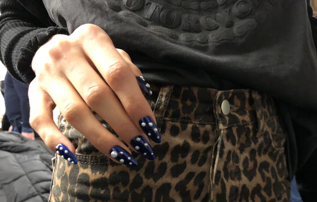nails and cheetah print pants.