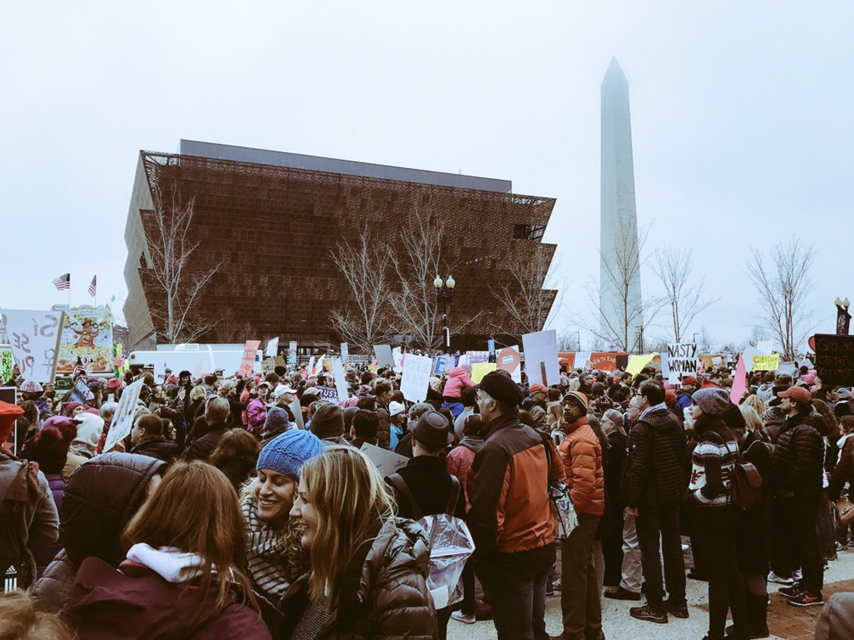 Washington, 1/21: Marchers in front of National Museum of African American History and Culture; Washington Monument in the background, the fog is everywhere