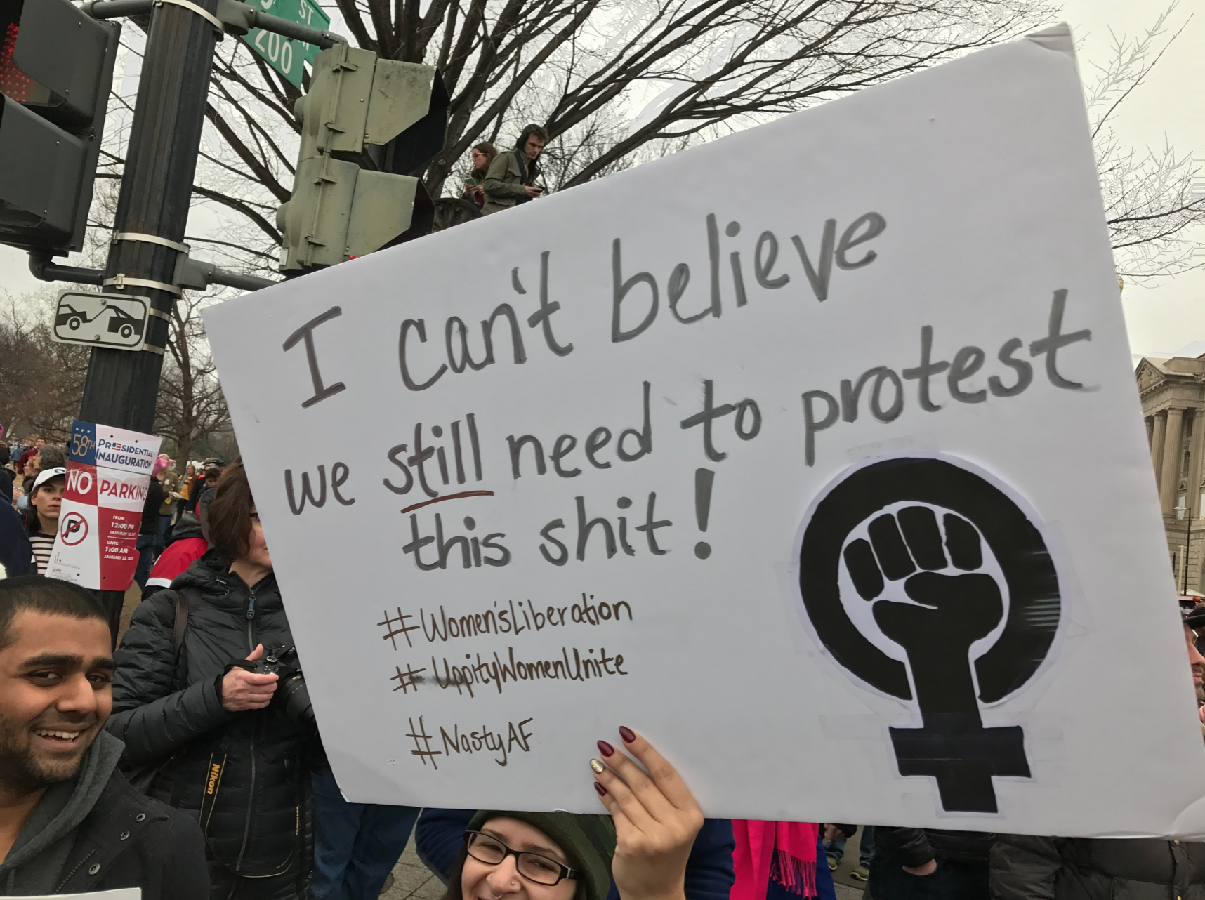 Sign reading: “I can’t believe we still need to protest this sh*t!”