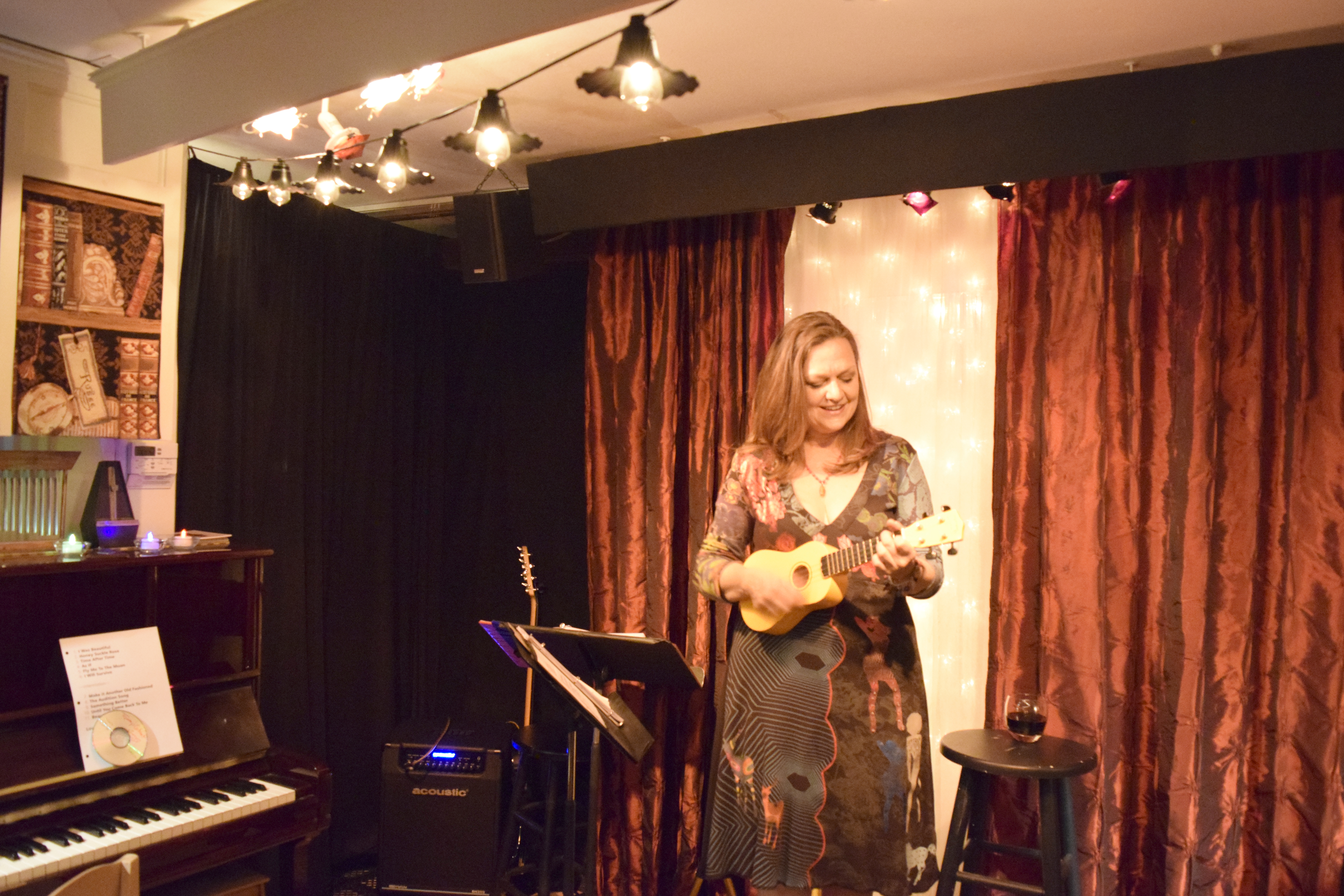 The cabaret’s featured performer Tamaralee Shutt, who is in six bands across the Central New York area, plays her ukulele during her set, which included unifying classics like “I Will Survive,” and Carole King’s  “Beautiful.”