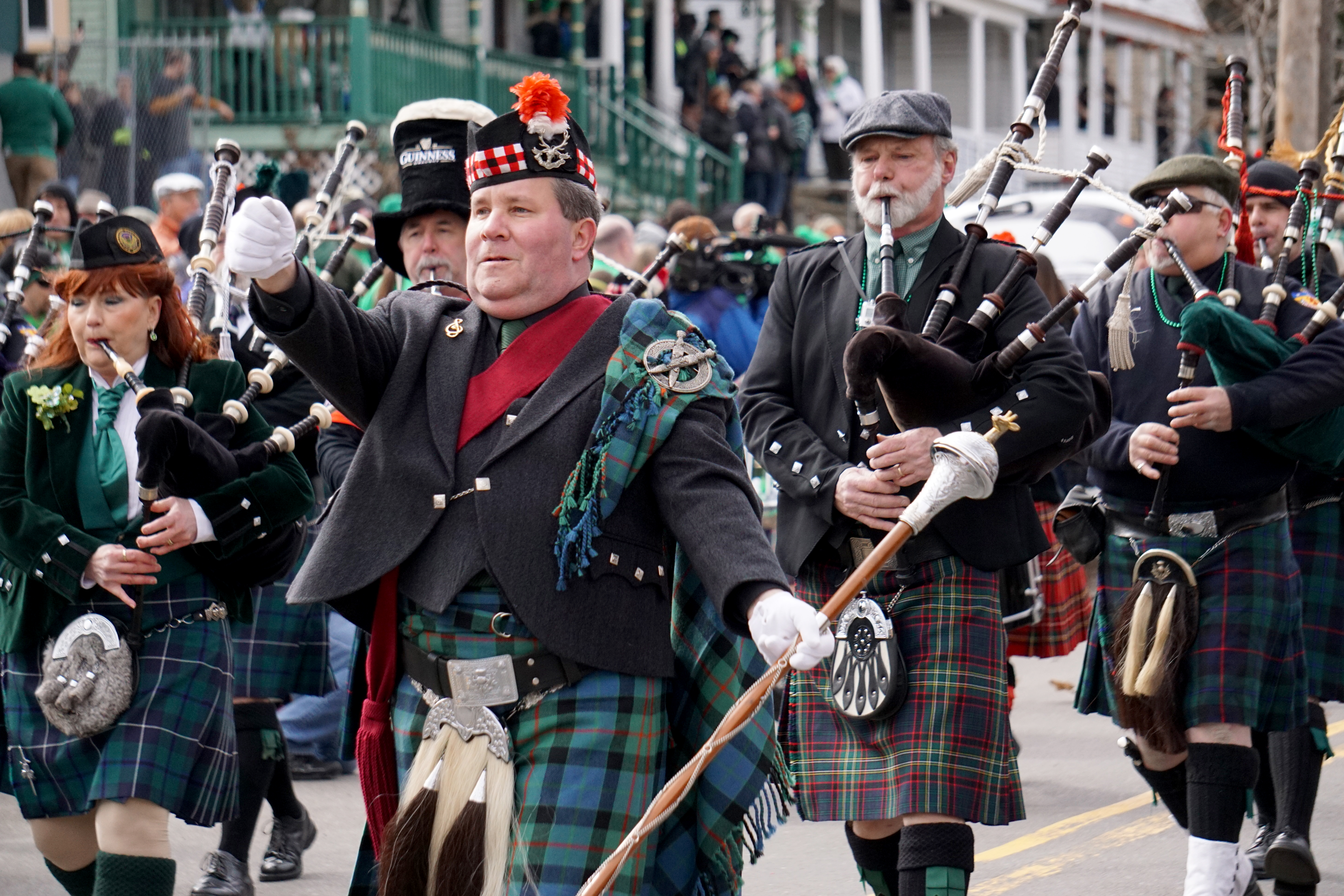 A pipe and drum band kicks off the noon-time parade for Green Beer Sunday. Attendees say the traditional music is a favorite part of the event.