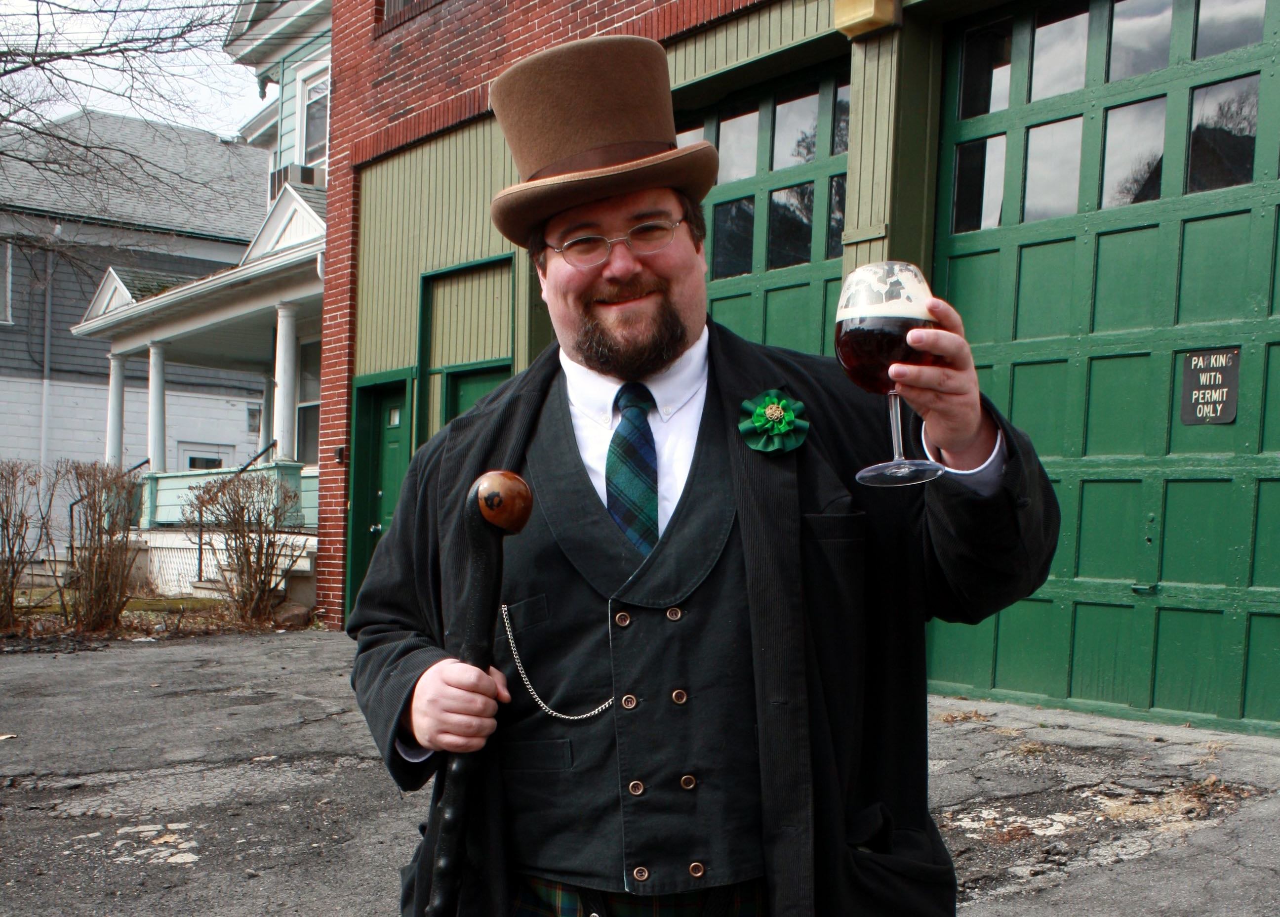 A decked-out Peter Sheey takes part in the spectacle, beer in hand. 